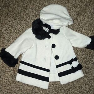 Cream-colored SAVANNAH BABY dress coat with faux fur collar, cuffs, and bows.